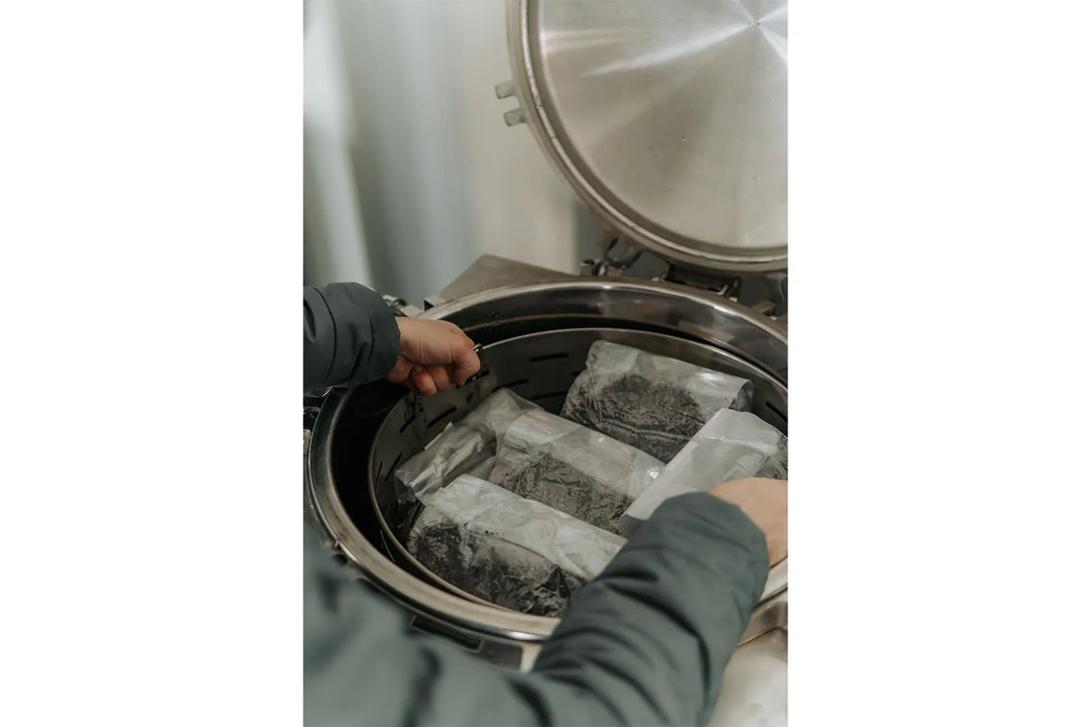 Grow bag being placed into the autoclave