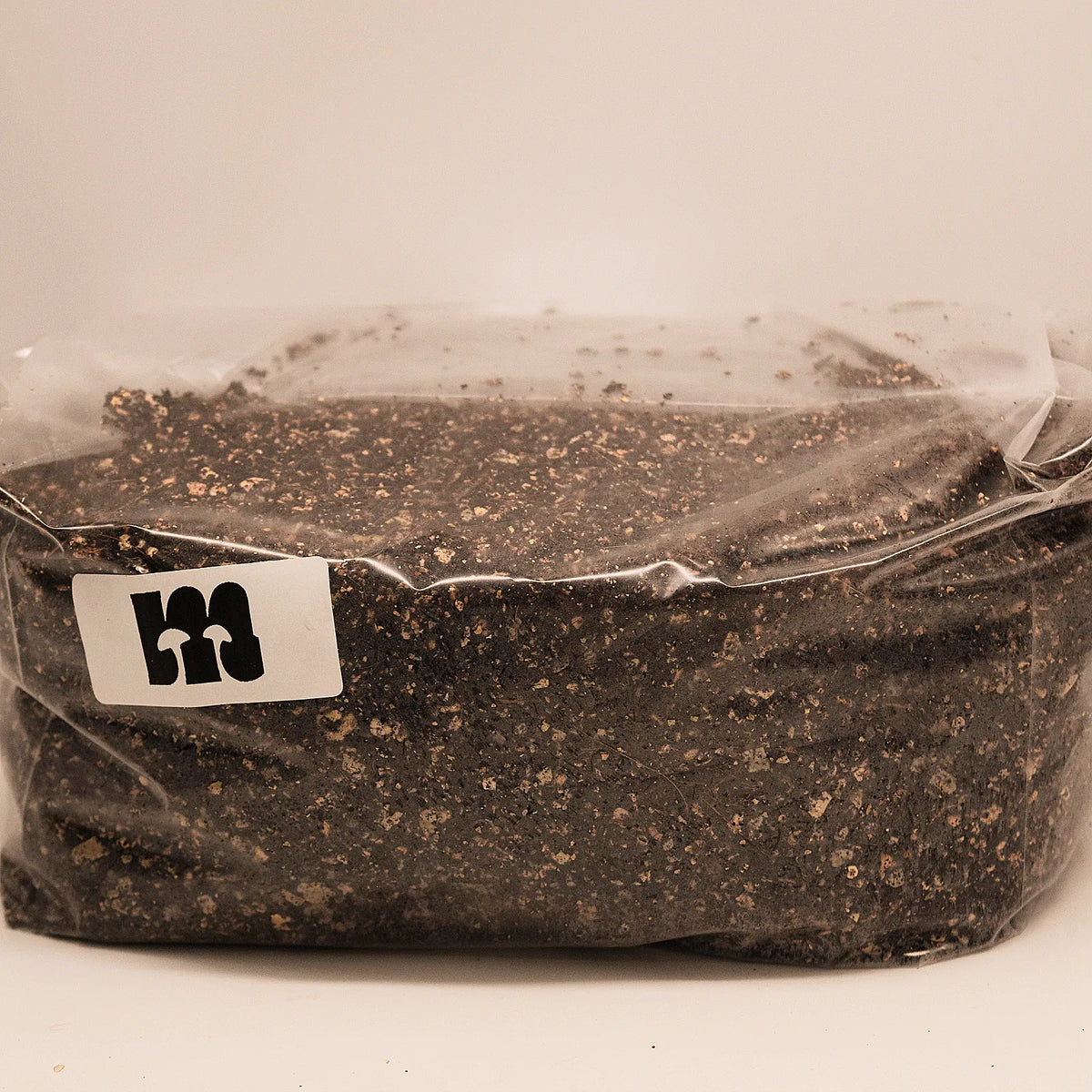 Bag of sterile CVG substrate lying flat, with Meisterpilze sticker