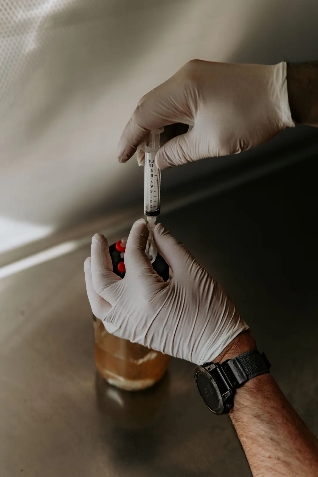 Inoculating the liquid culture jar with a syringe